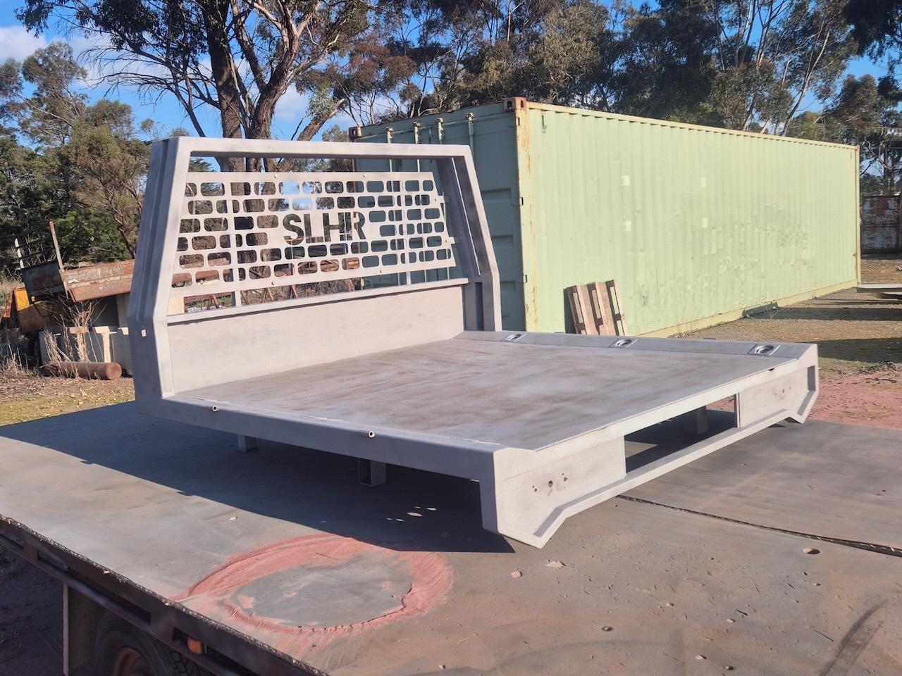 Steel ute tray blasted to clean metal, sitting on a truck deck